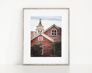 Red Barn with a Cupola and Weathervane