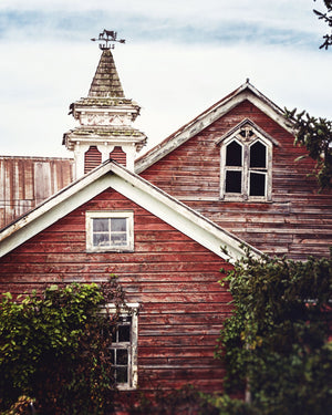 Red Barn with a Cupola and Weathervane