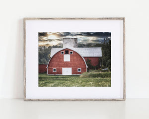 Red Oval-Shaped Barn at Sunset