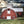 Red Oval-Shaped Barn at Sunset